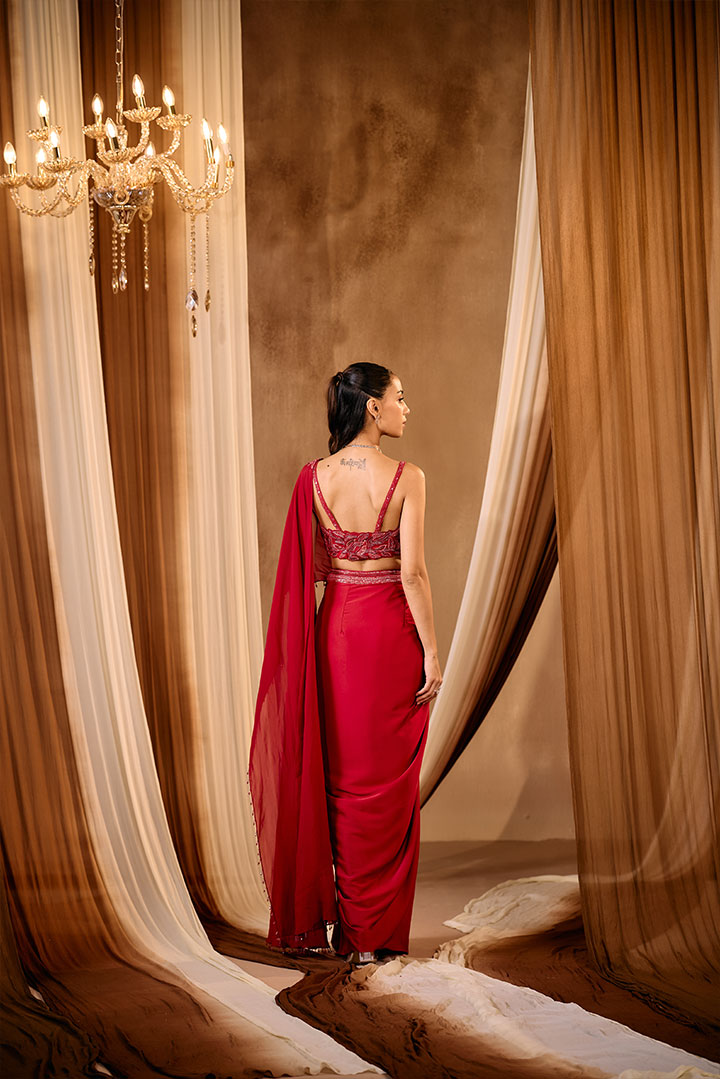 Red embroidered blouse with pre draped saree
