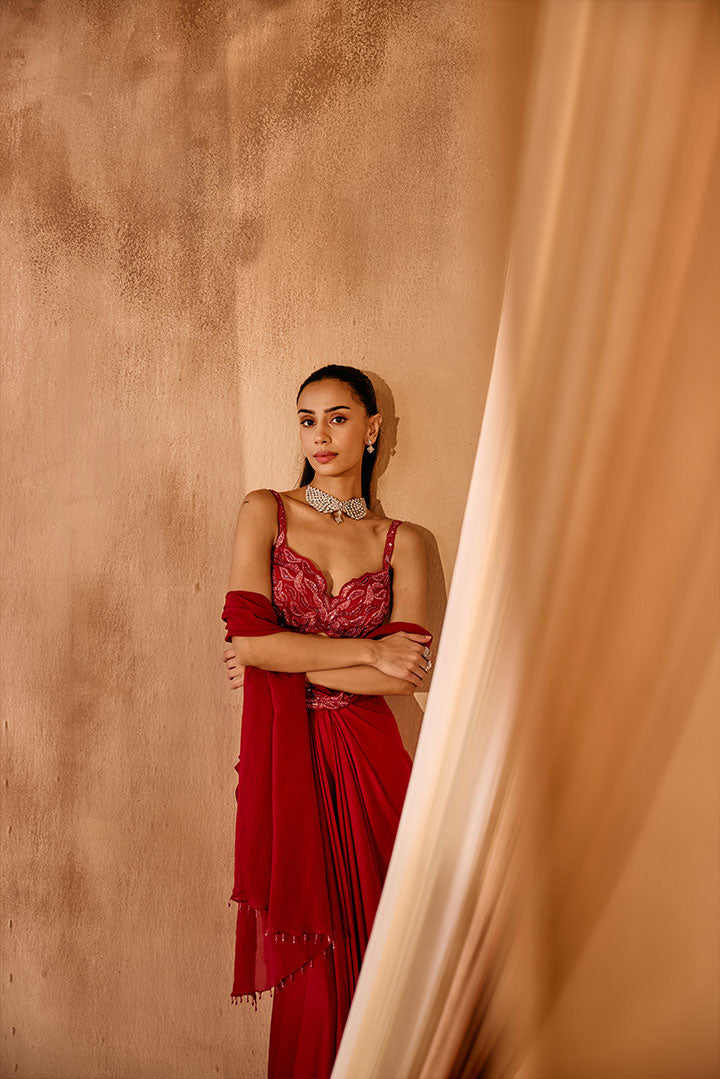 Red embroidered blouse with pre draped saree