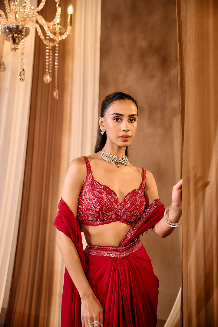 Red embroidered blouse with pre draped saree