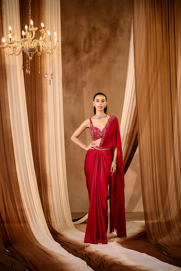 Red embroidered blouse with pre draped saree