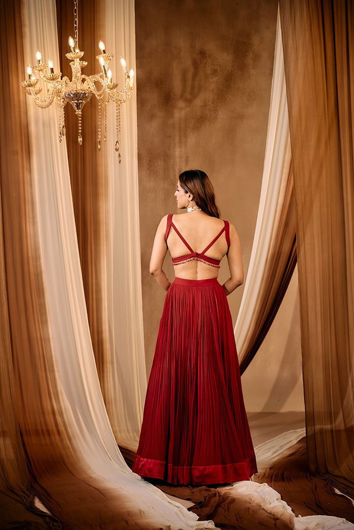 Ruby Red Pleated lehenga skirt with blouse and cape