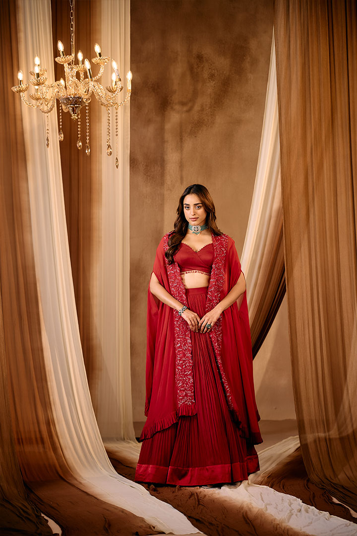 Ruby Red Pleated lehenga skirt with blouse and cape